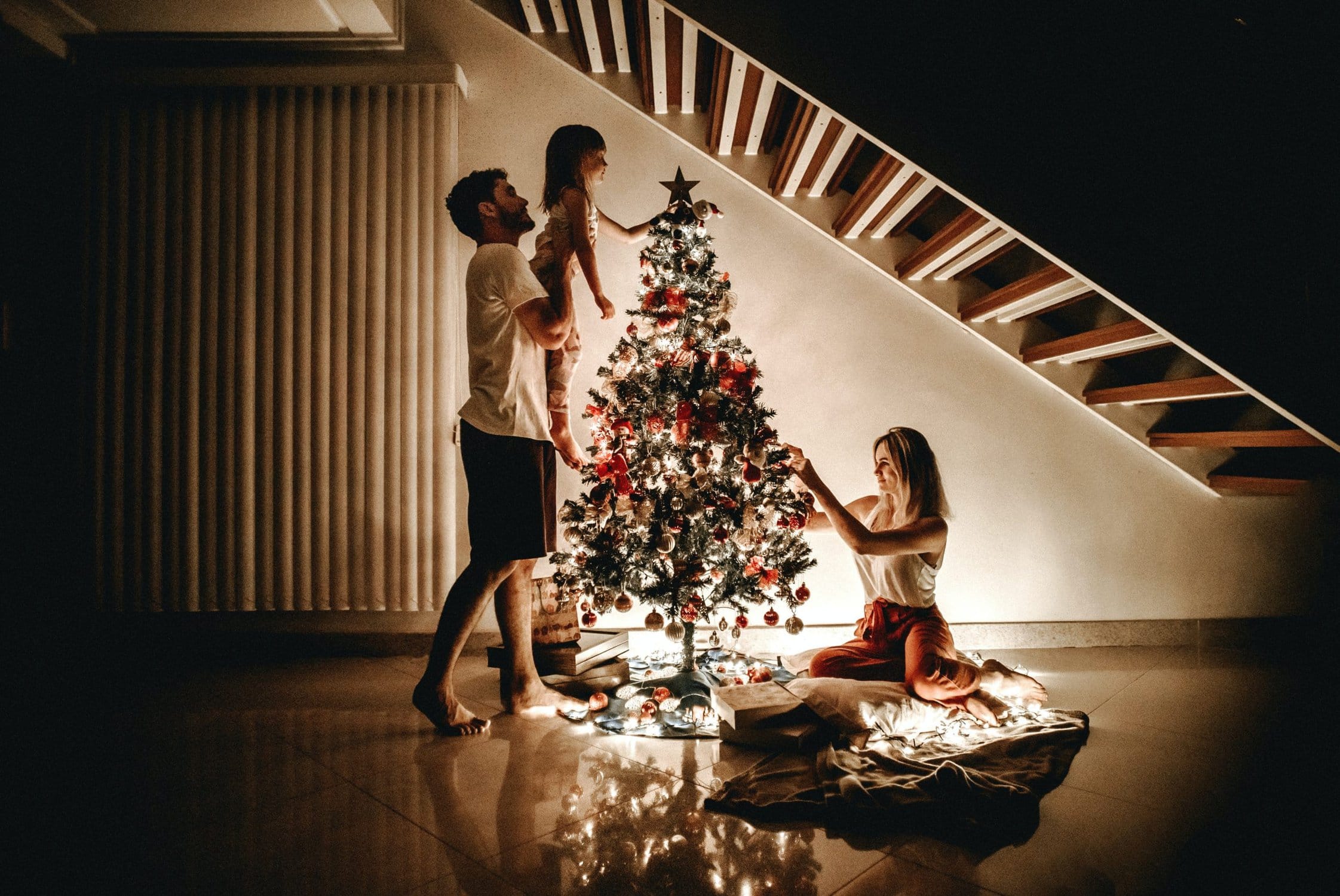 family putting up christmas tree - xo marriage